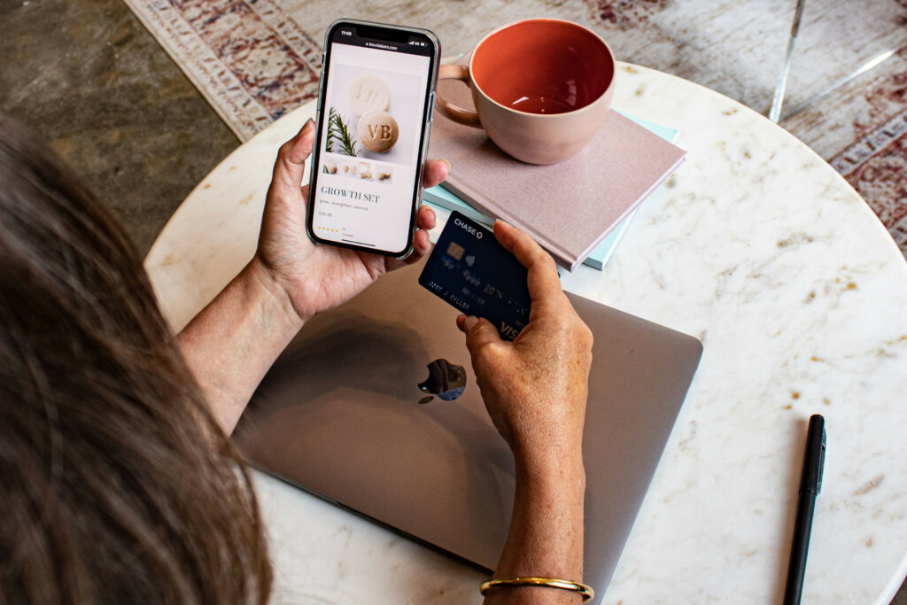 Someone shopping online with their credit card ready