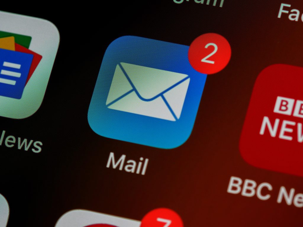 Close-up of an email icon on a smart phone with two messages waiting.